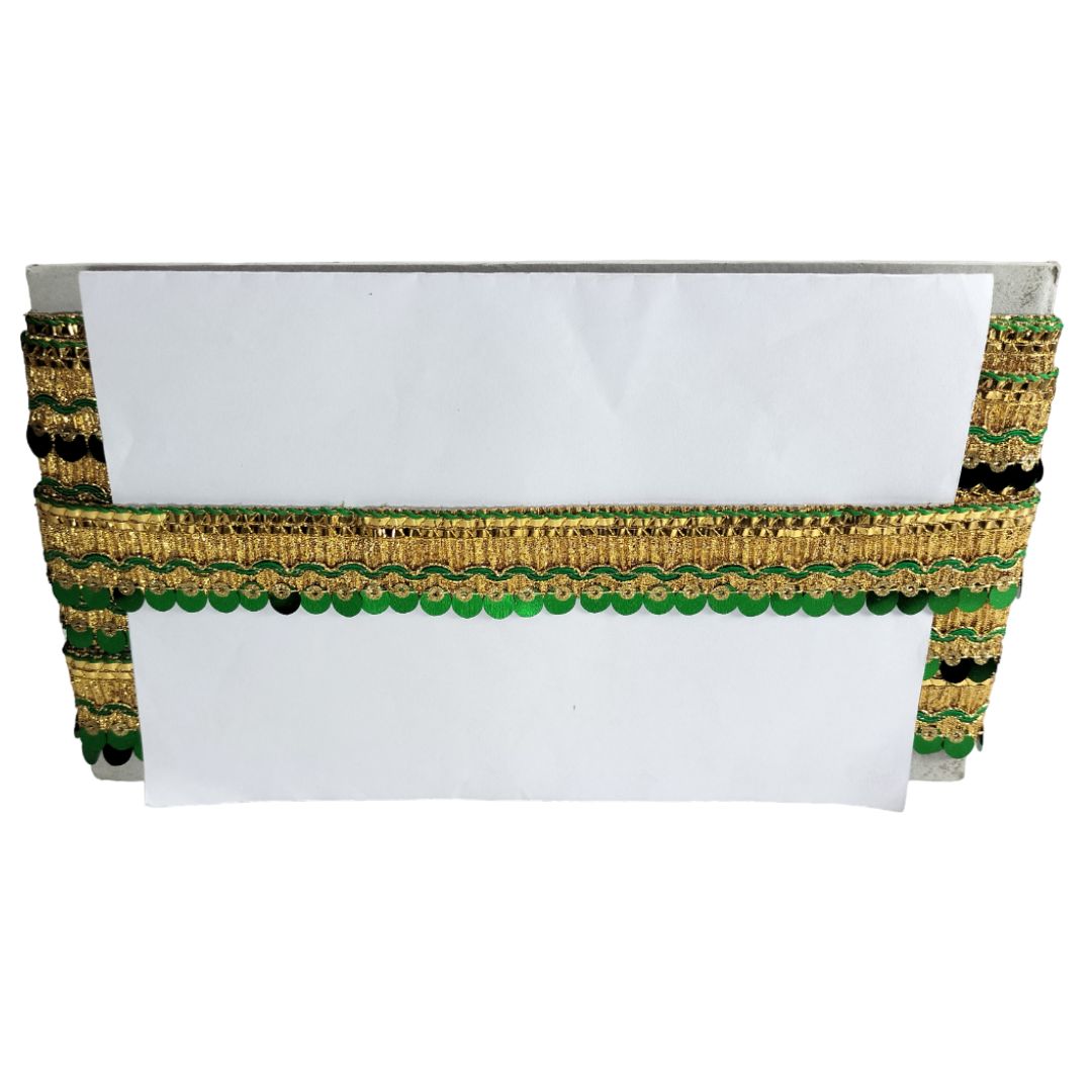 Decorative white box with gold and green trim on a white background