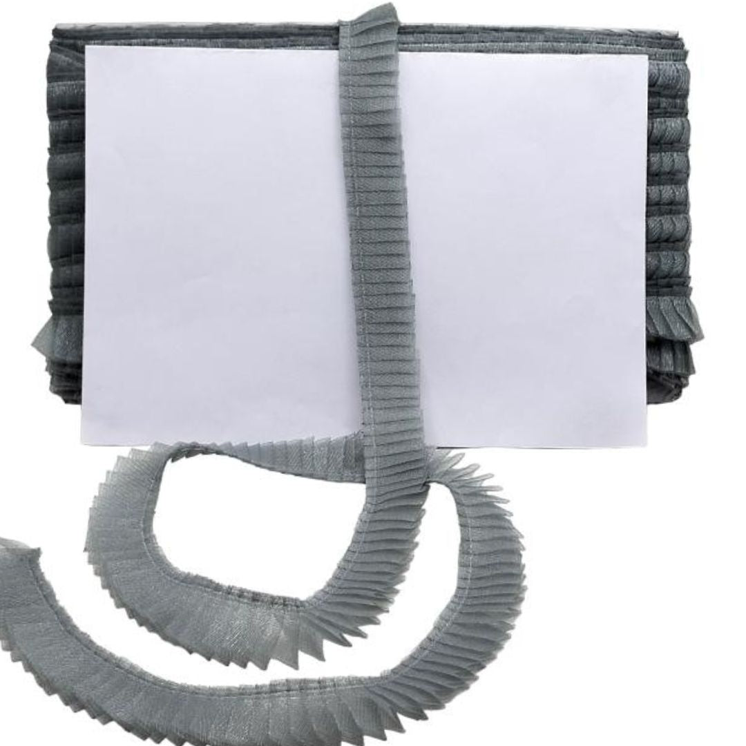 Gray pleated belt with a white square in the center on a white background