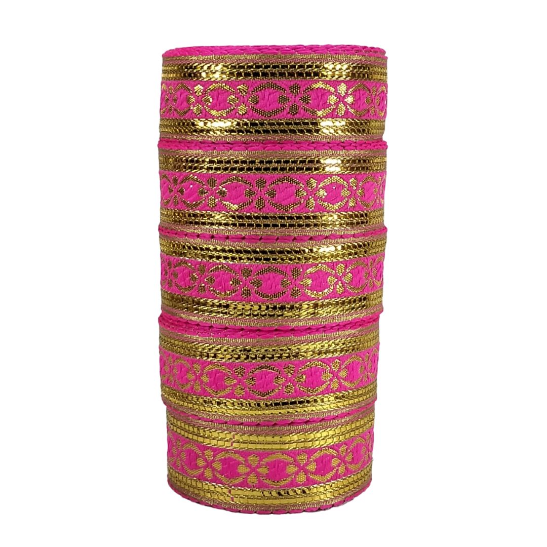 Set of pink and gold bangles on a white background
