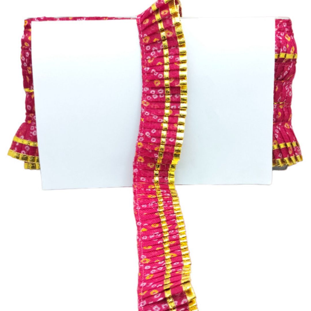 Pink and yellow patterned fabric with a white center on a white background