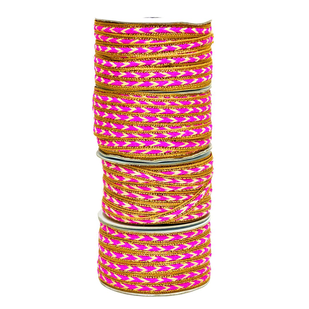 Stack of pink and gold bangles on a white background