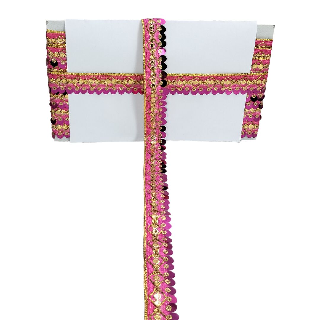White fabric with pink and gold decorative border on a white background