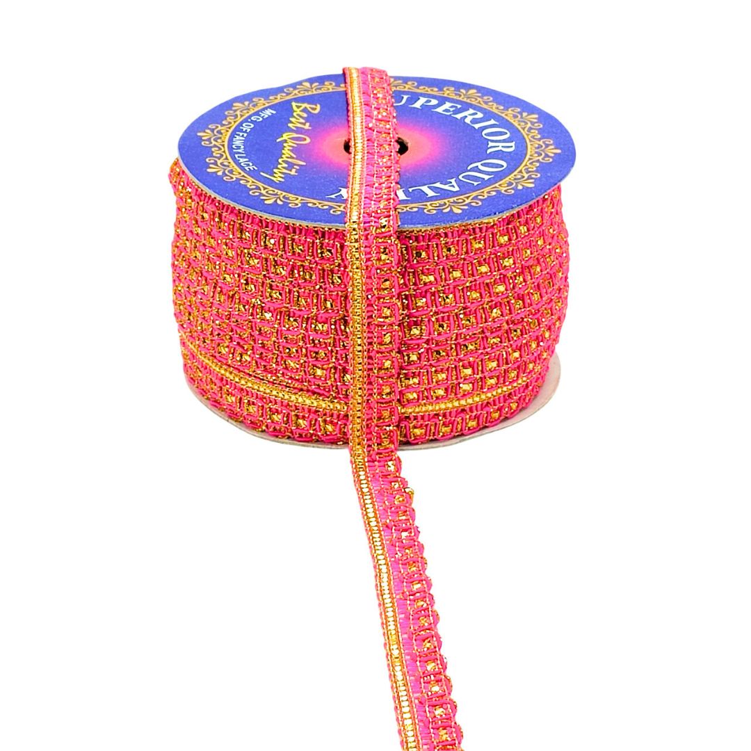 Spool of pink and gold ribbon with 'Superior Quality' label on a white background