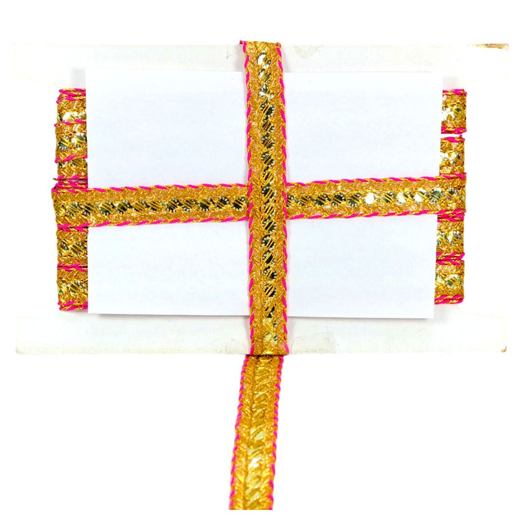 Decorative belt with gold and pink patterns on a white background