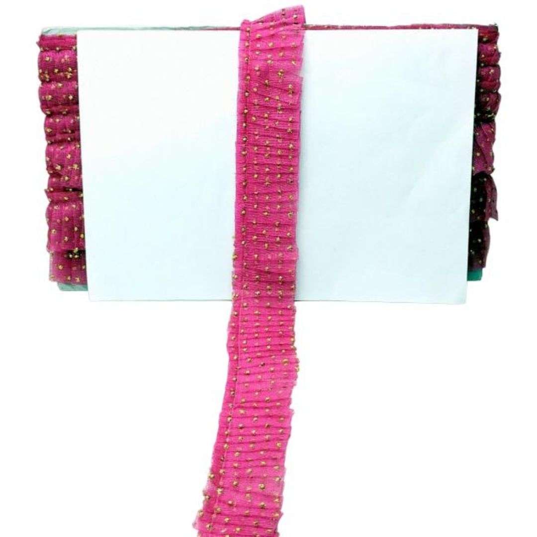 Pink beaded scarf with a white background