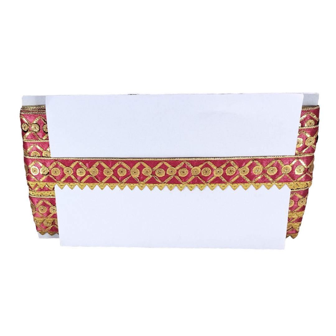 White fabric with red and gold decorative border on a white background
