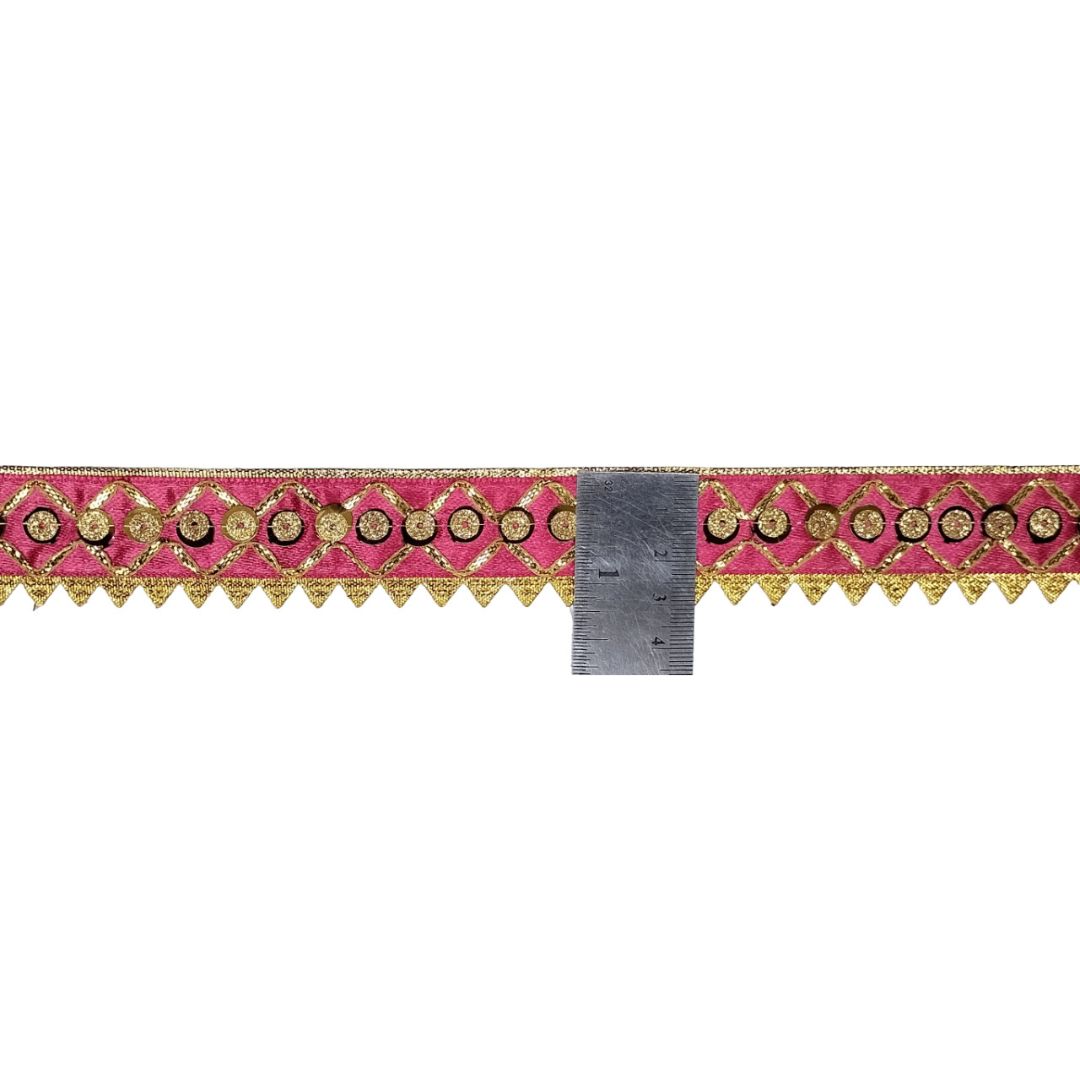 Decorative ribbon with pink and gold pattern on a white background