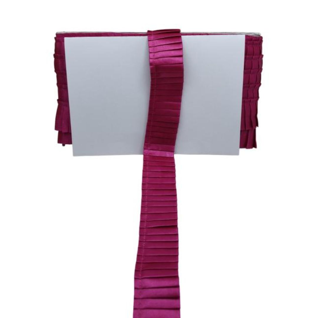 White card with a burgundy pleated ribbon on a white background