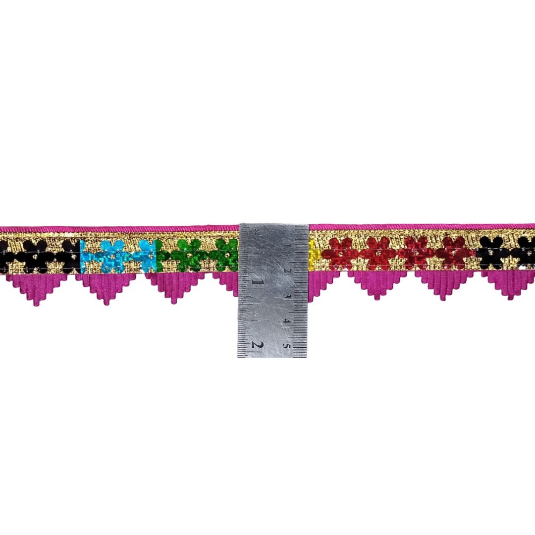 Decorative border strip with colorful patterns and a ruler for scale on a white background