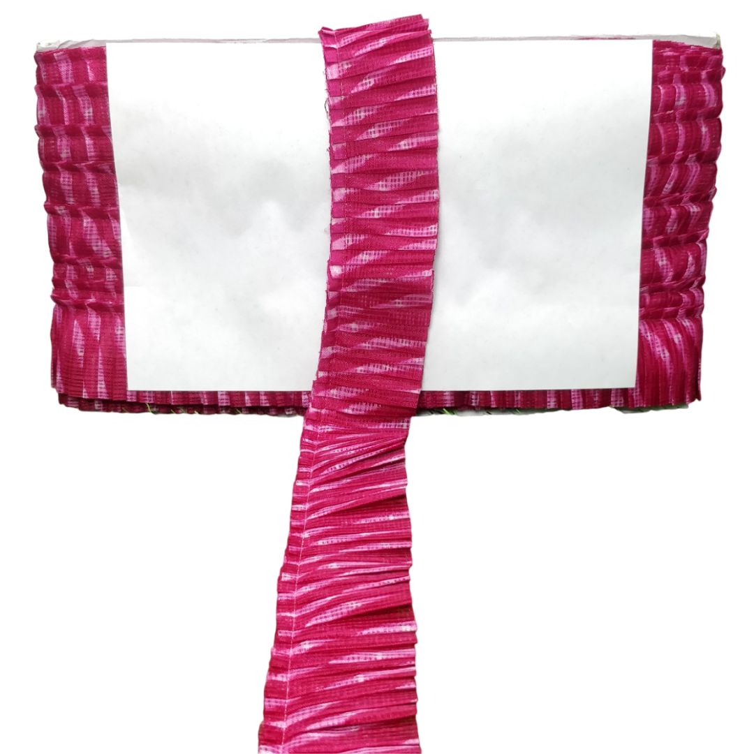 White top with pink ruffled sleeves on a white background