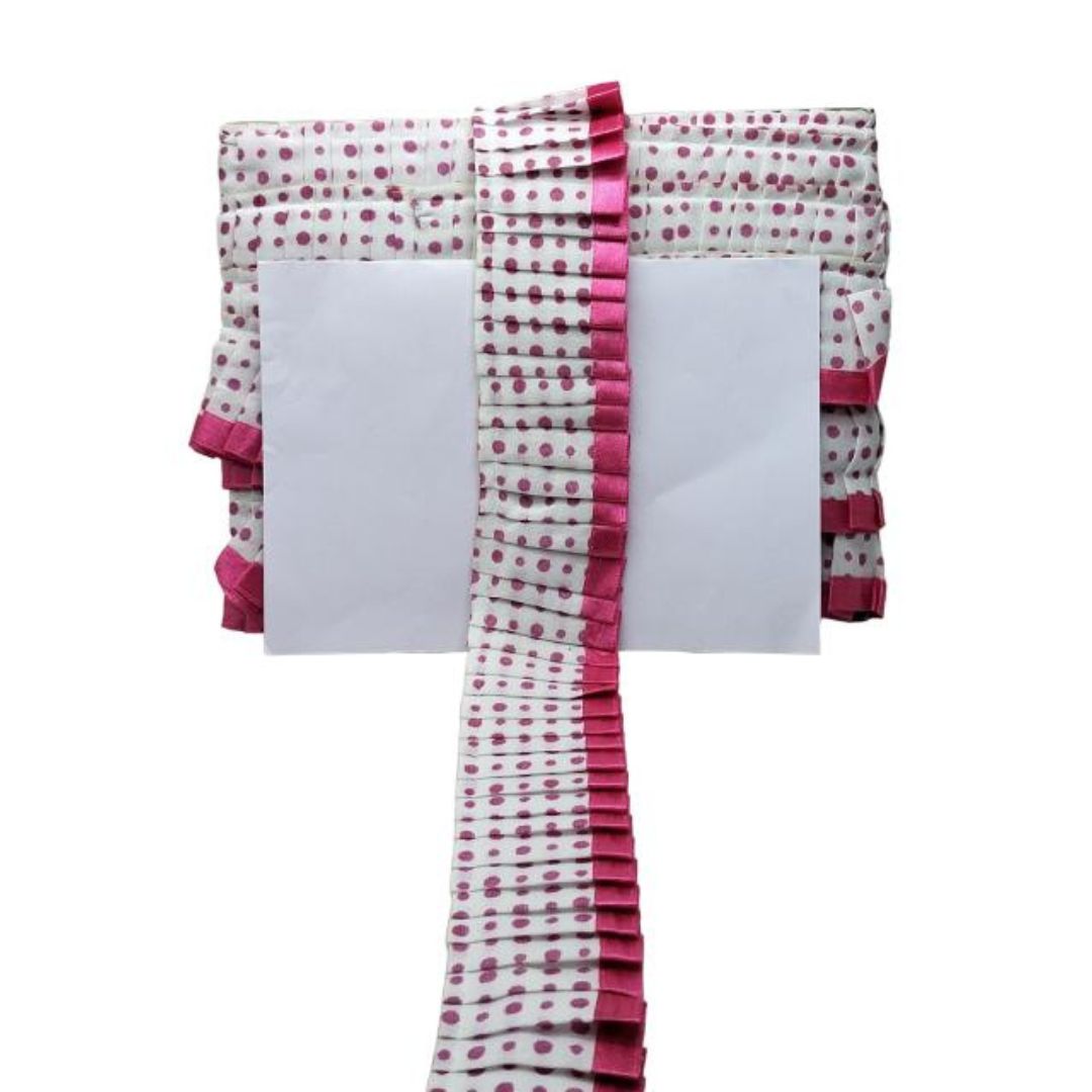 Polka dot scarf with pink trim on a white background