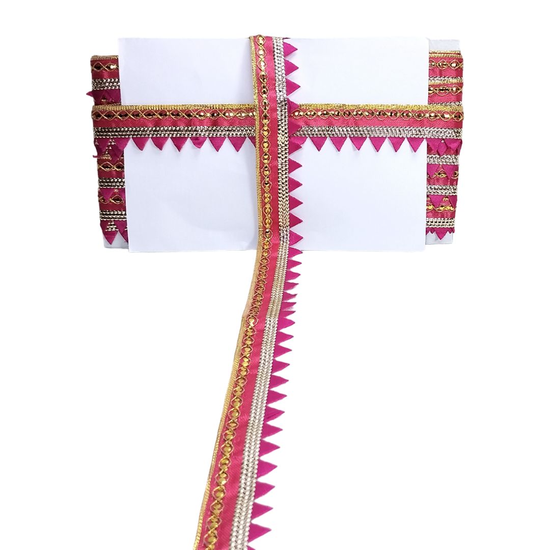 Decorative headband with pink and gold patterns on a white background