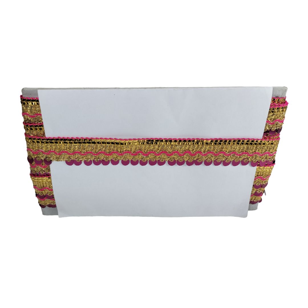 White clutch bag with gold and pink decorative trim on a white background