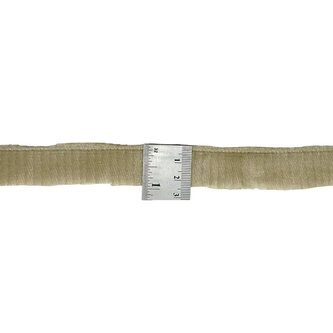 Beige ribbon with a ruler for measurement on a white background