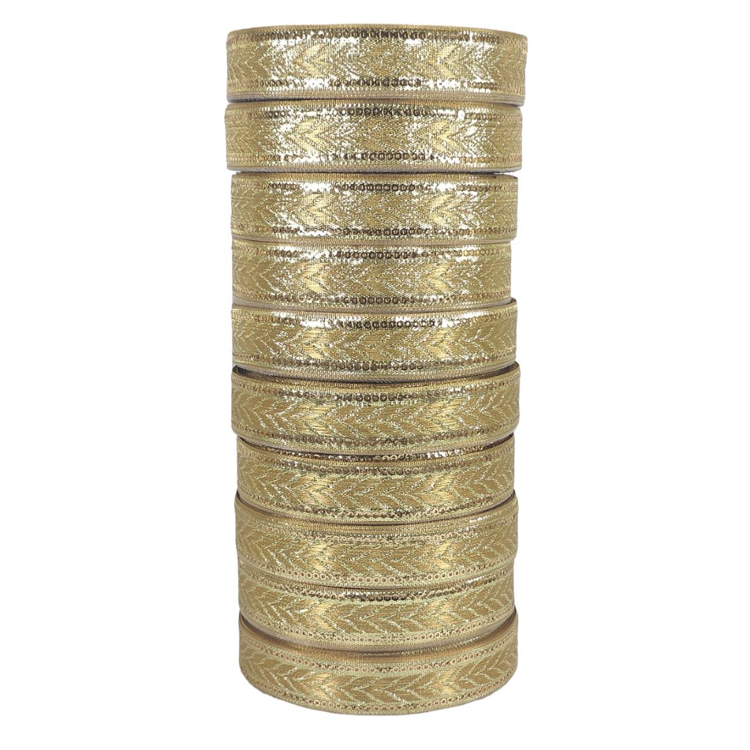 Stack of gold and silver bangles on a white background