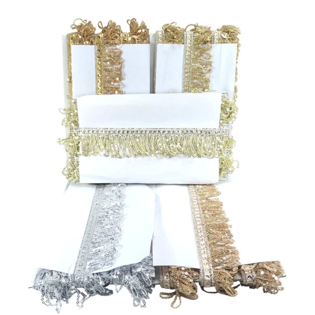 Decorative chair with gold and silver fringe on a white background