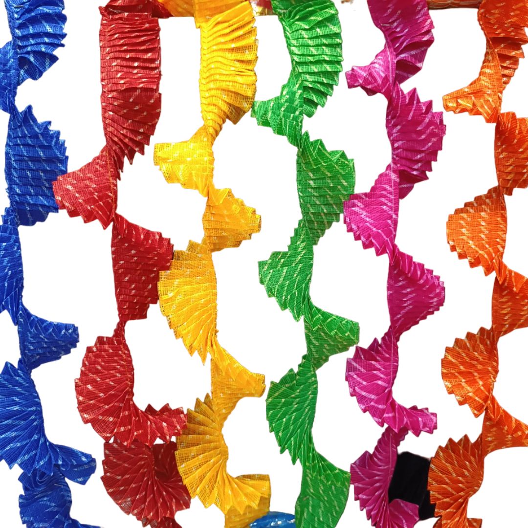 Colorful ribbed pasta in red, yellow, green, pink, and orange on a white background