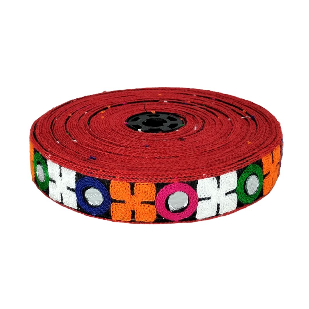 Red bicycle rim tape with colorful geometric pattern on a white background