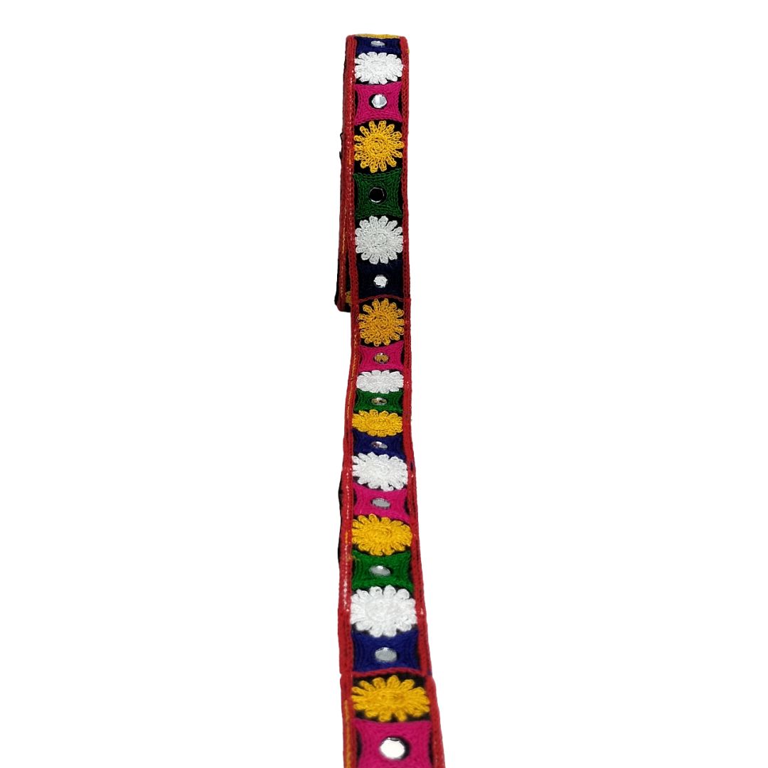 Colorful dog collar with floral patterns on a white background