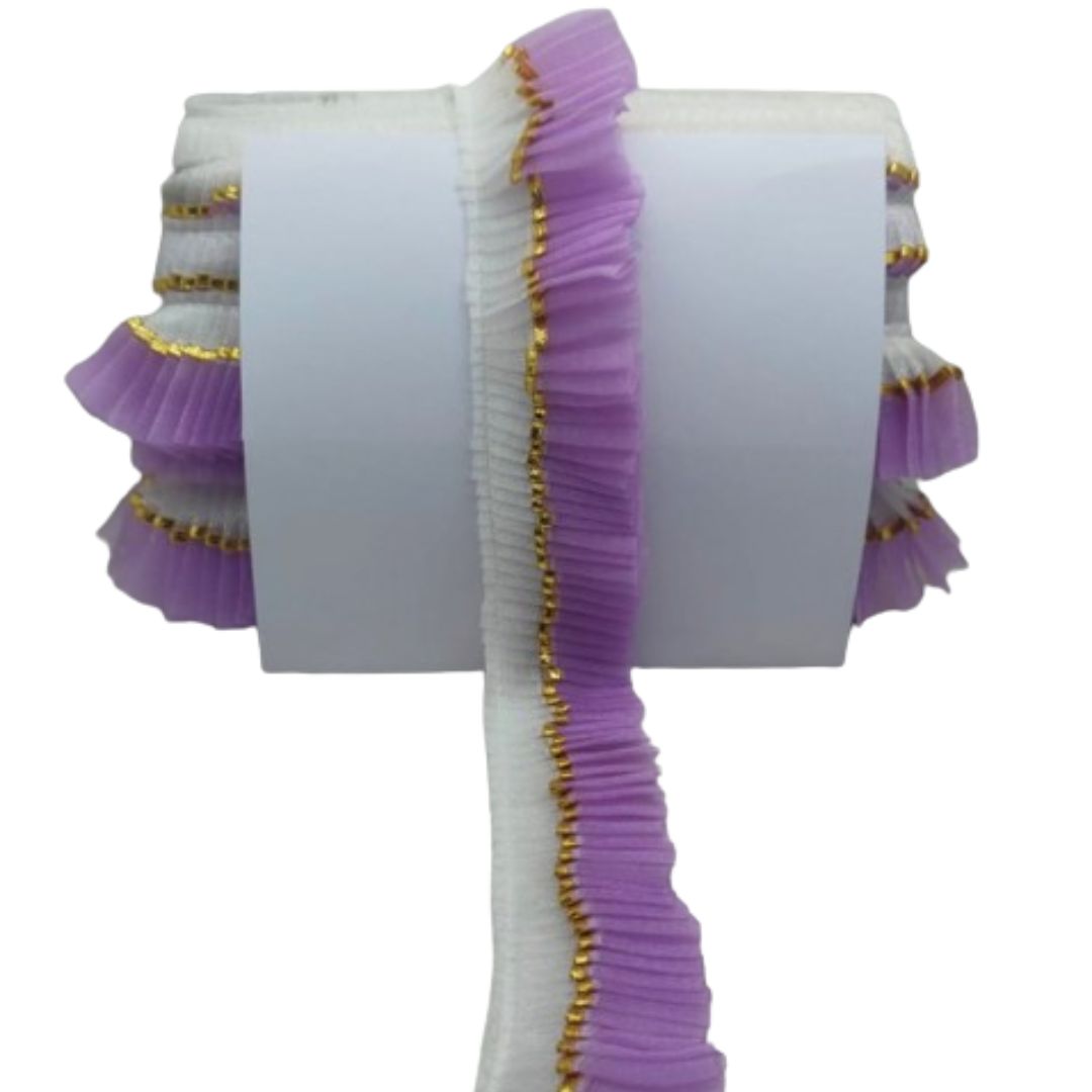 White fabric with purple ruffles and gold trim on a white background