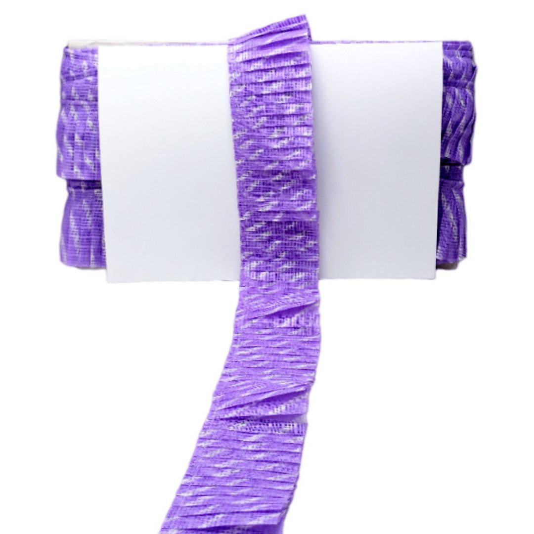 White tablecloth with purple ruffled trim on a white background