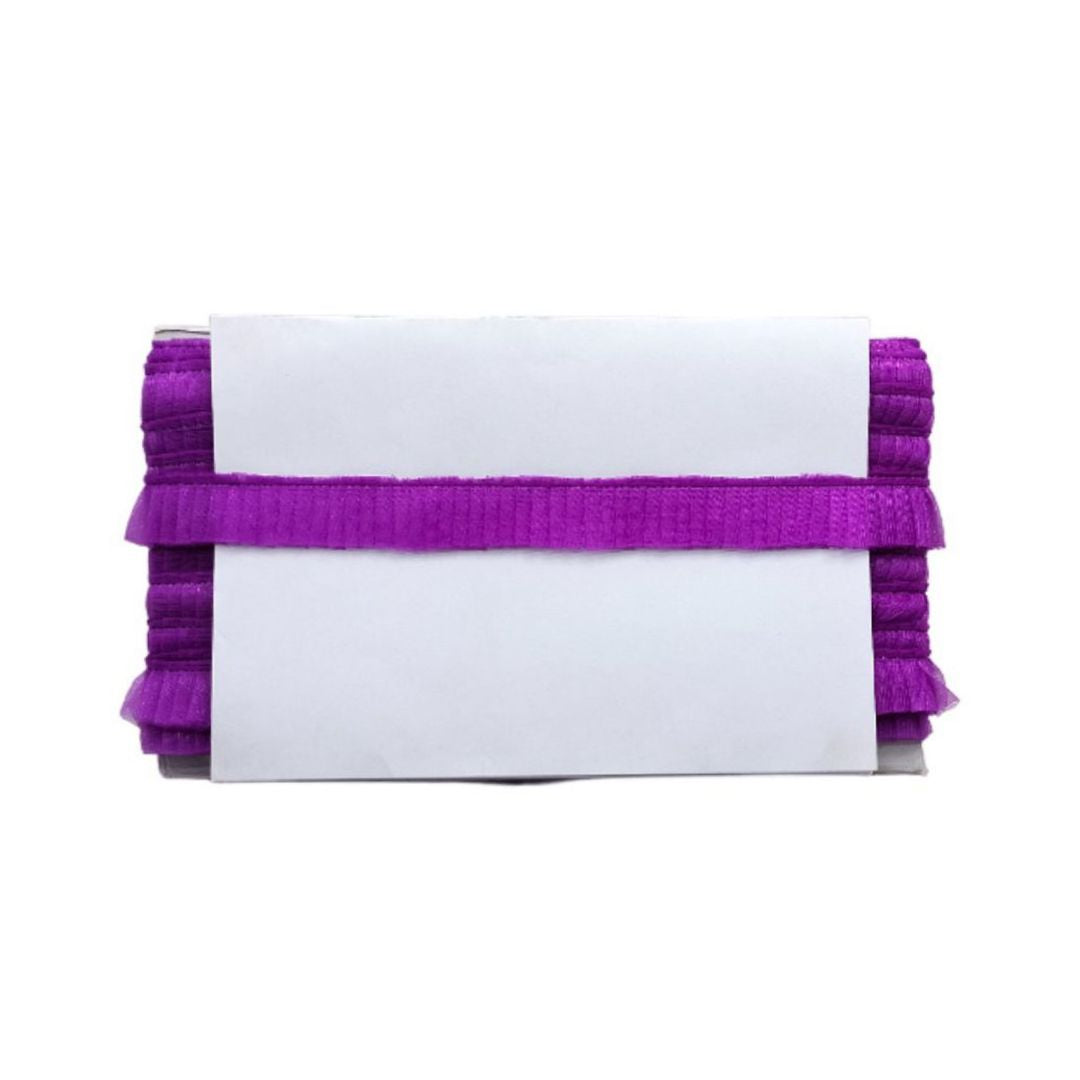 White clutch with purple ruffles on a white background