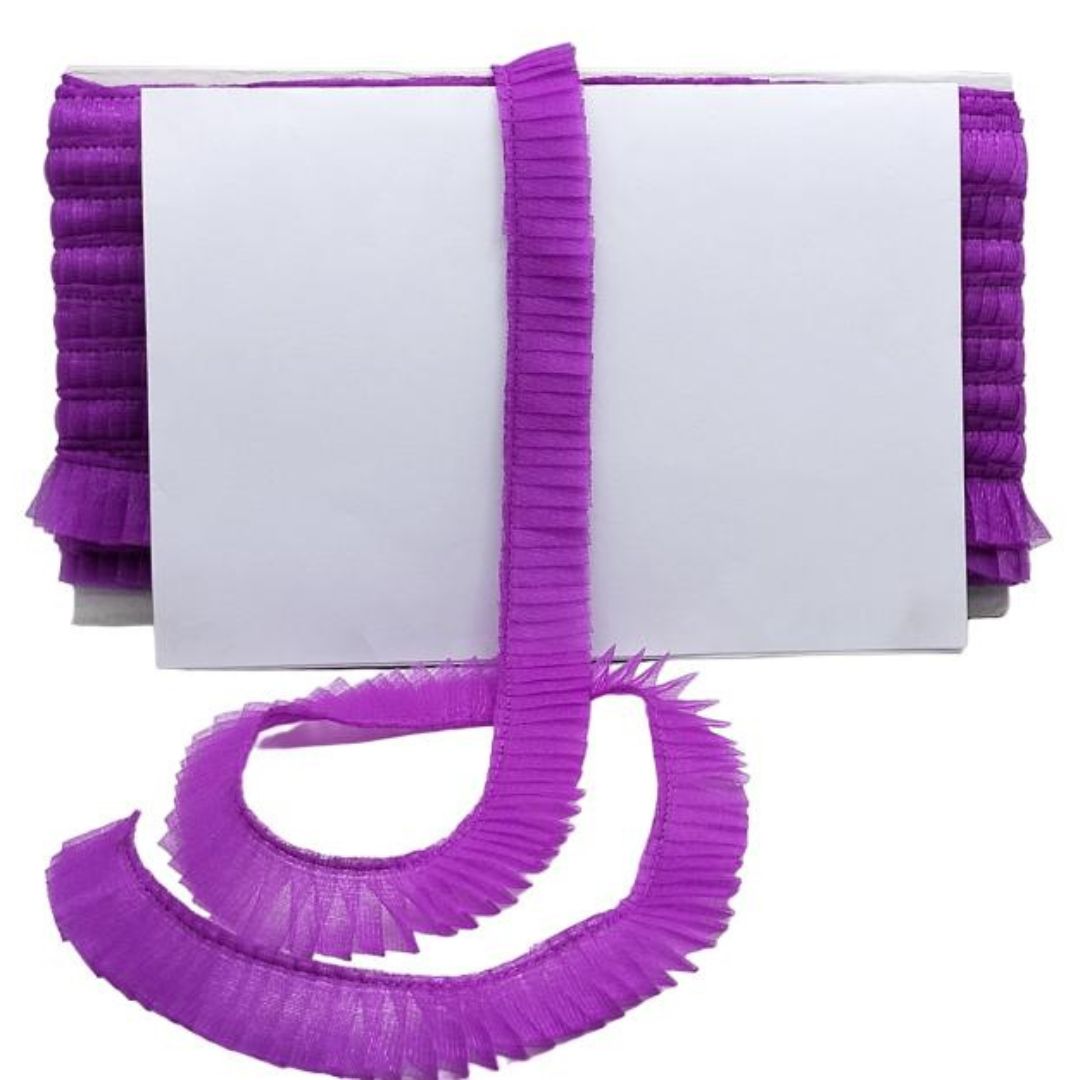 Purple ruffled pet lead and collar on a white background