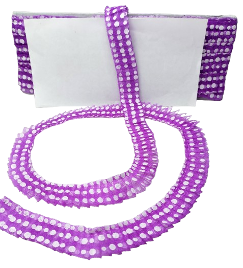 Purple polka dot ribbon with a white container on a white background