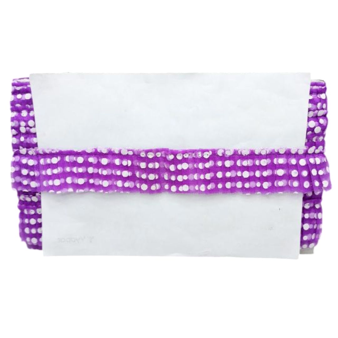 White clutch with purple beaded trim on a white background