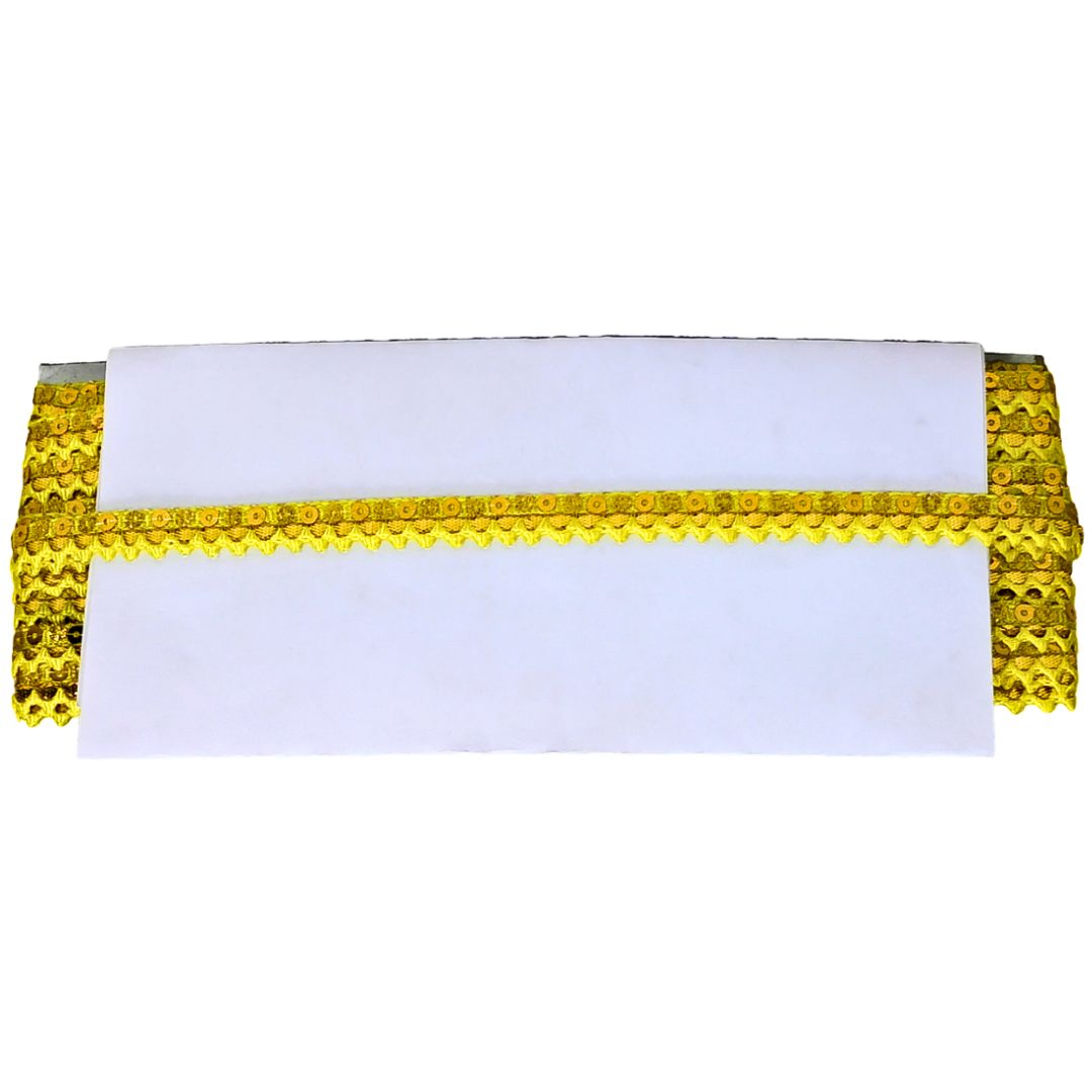 White pillow with gold decorative trim on a white background