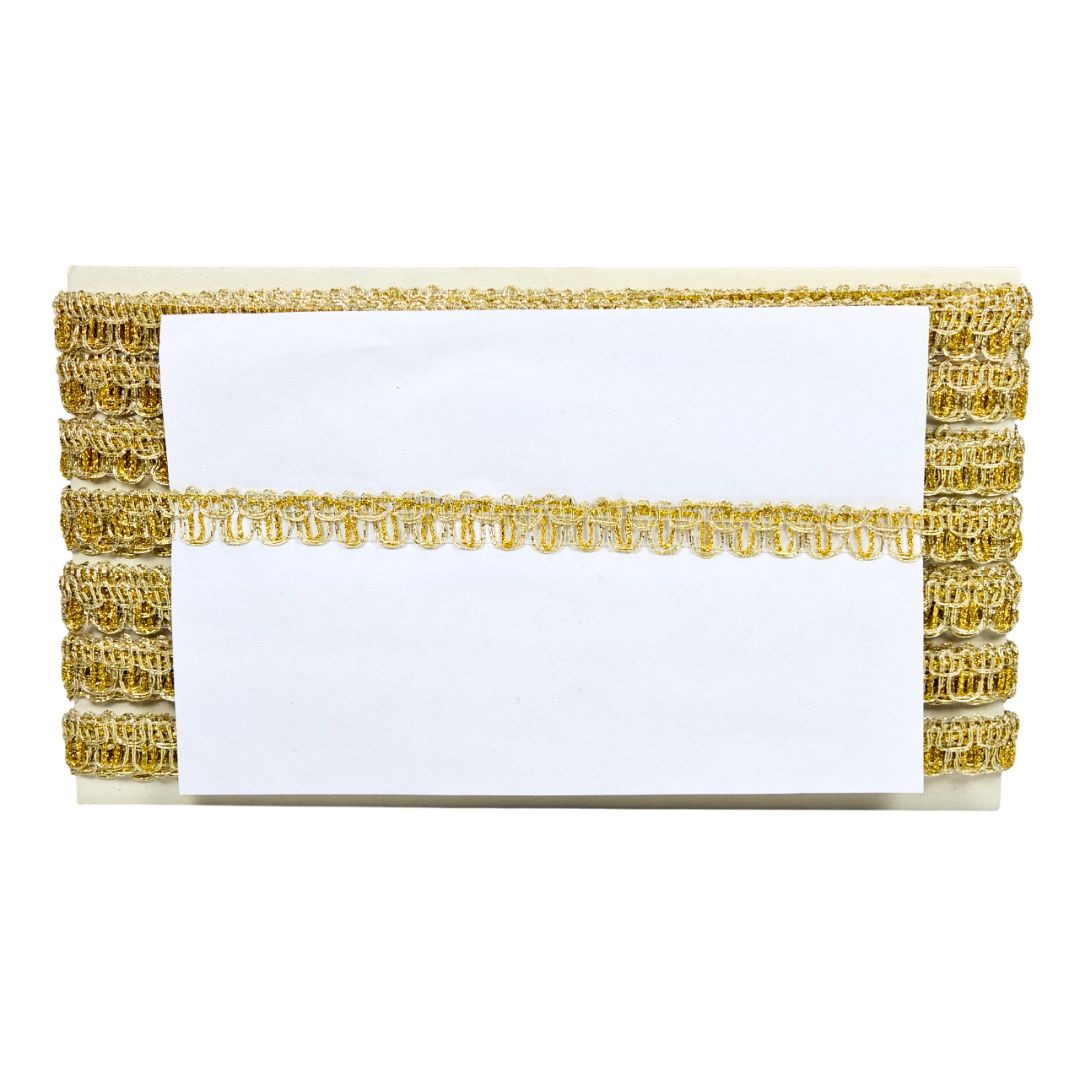 Gold and white decorative box with a white card inside on a white background