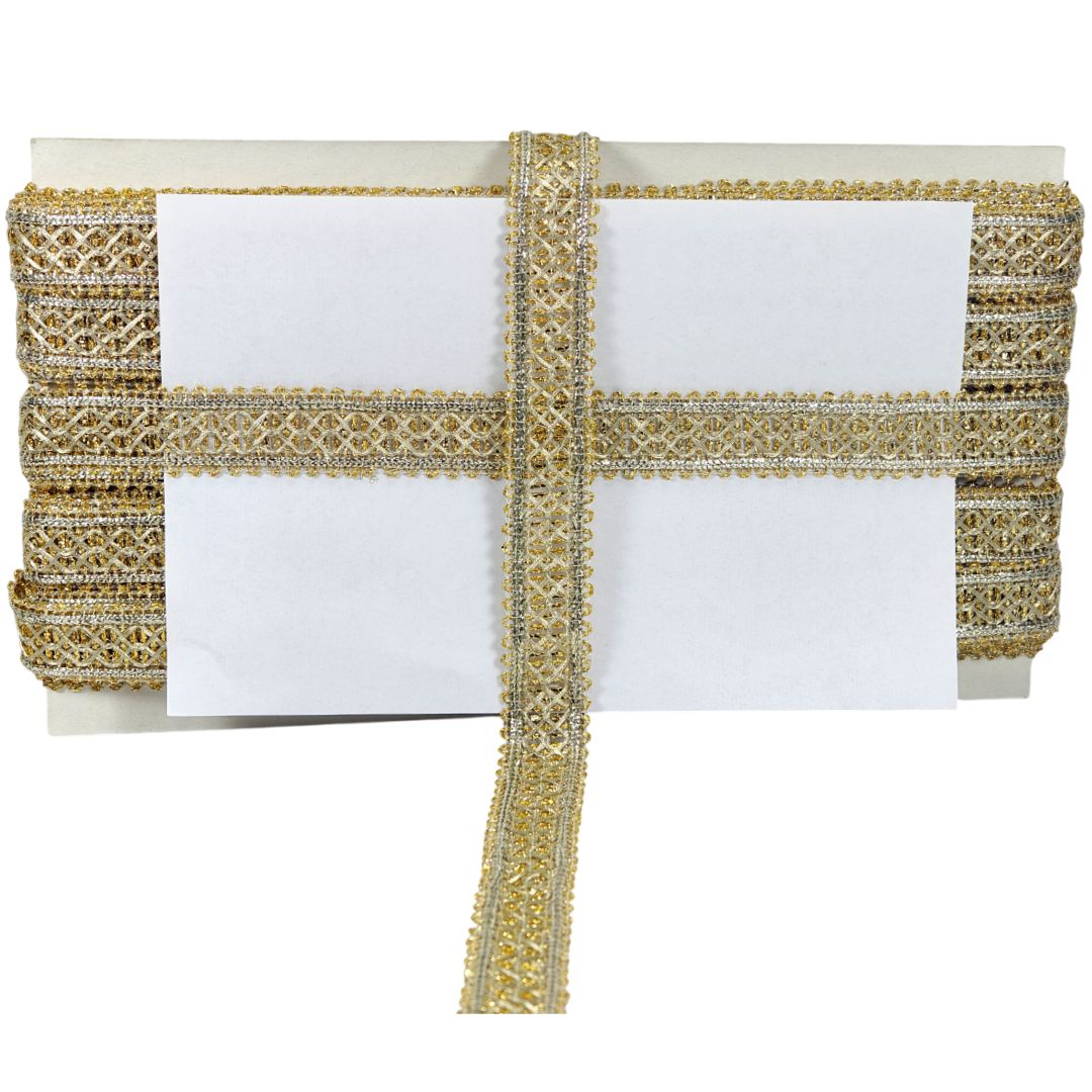 Gold clutch bag with decorative strap on a white background