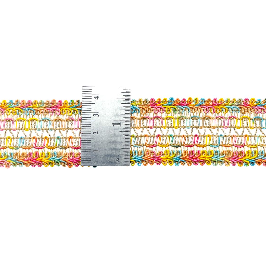 Colorful decorative trim with a ruler for scale on a white background