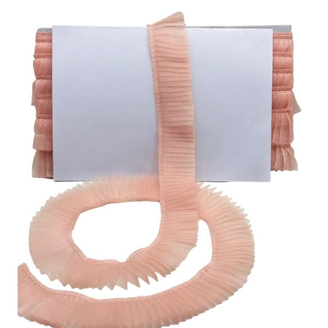 Pink ribbed hose on a white background