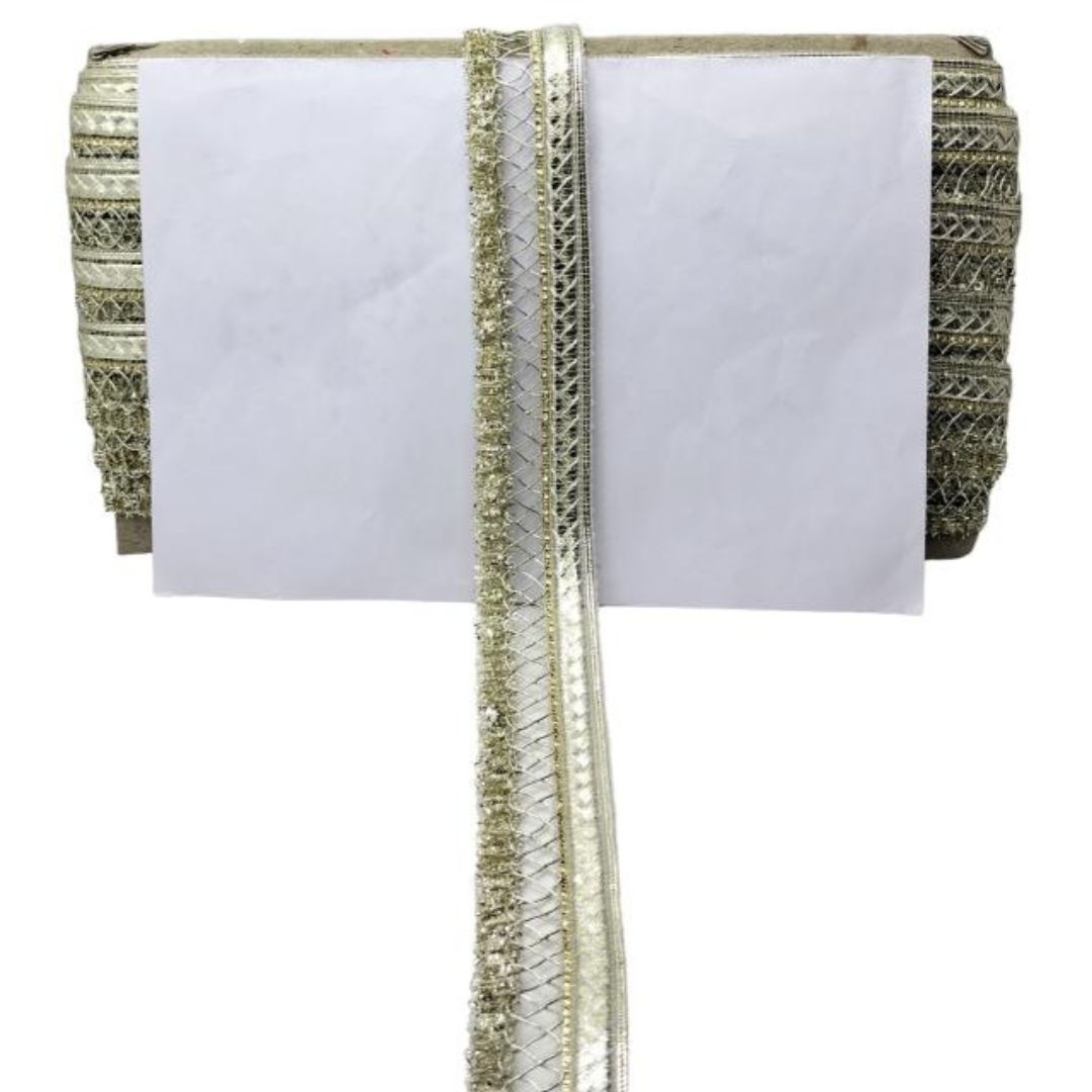 White saree with gold and green border on a white background