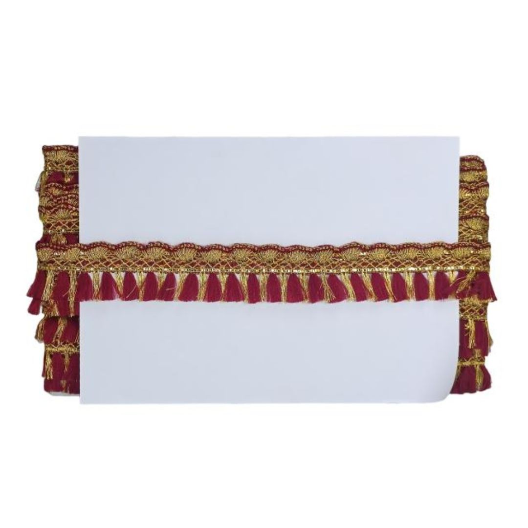 Decorative cornice with red and gold fringe on a white background