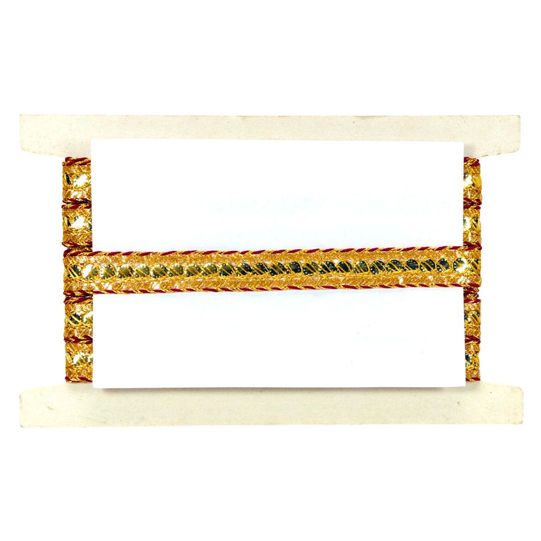 Decorative shelf with gold and green accents on a white background