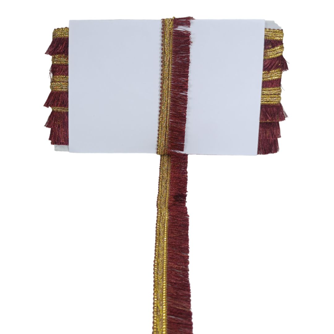 Decorative ribbon with maroon and gold fringes on a white background