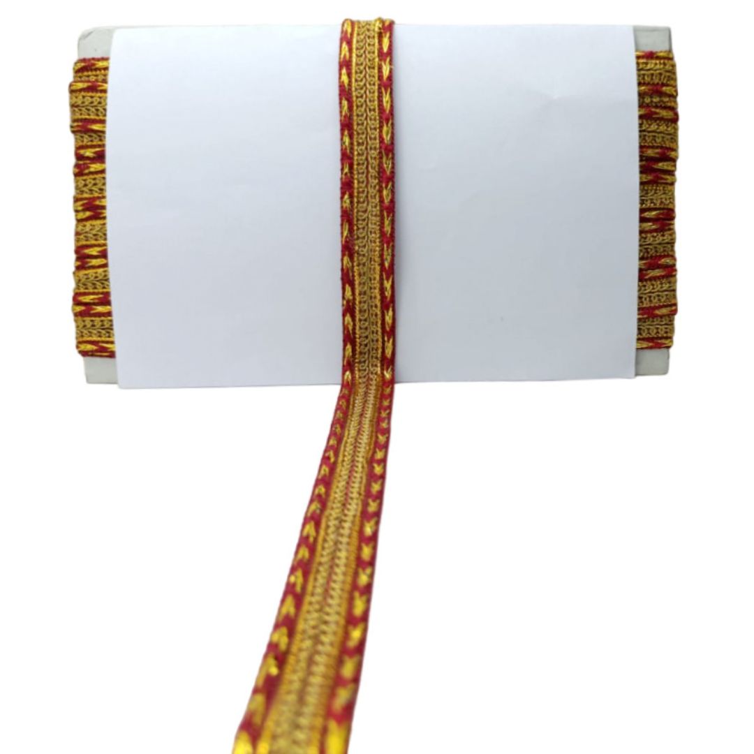 Decorative headband with red and gold pattern on a white background