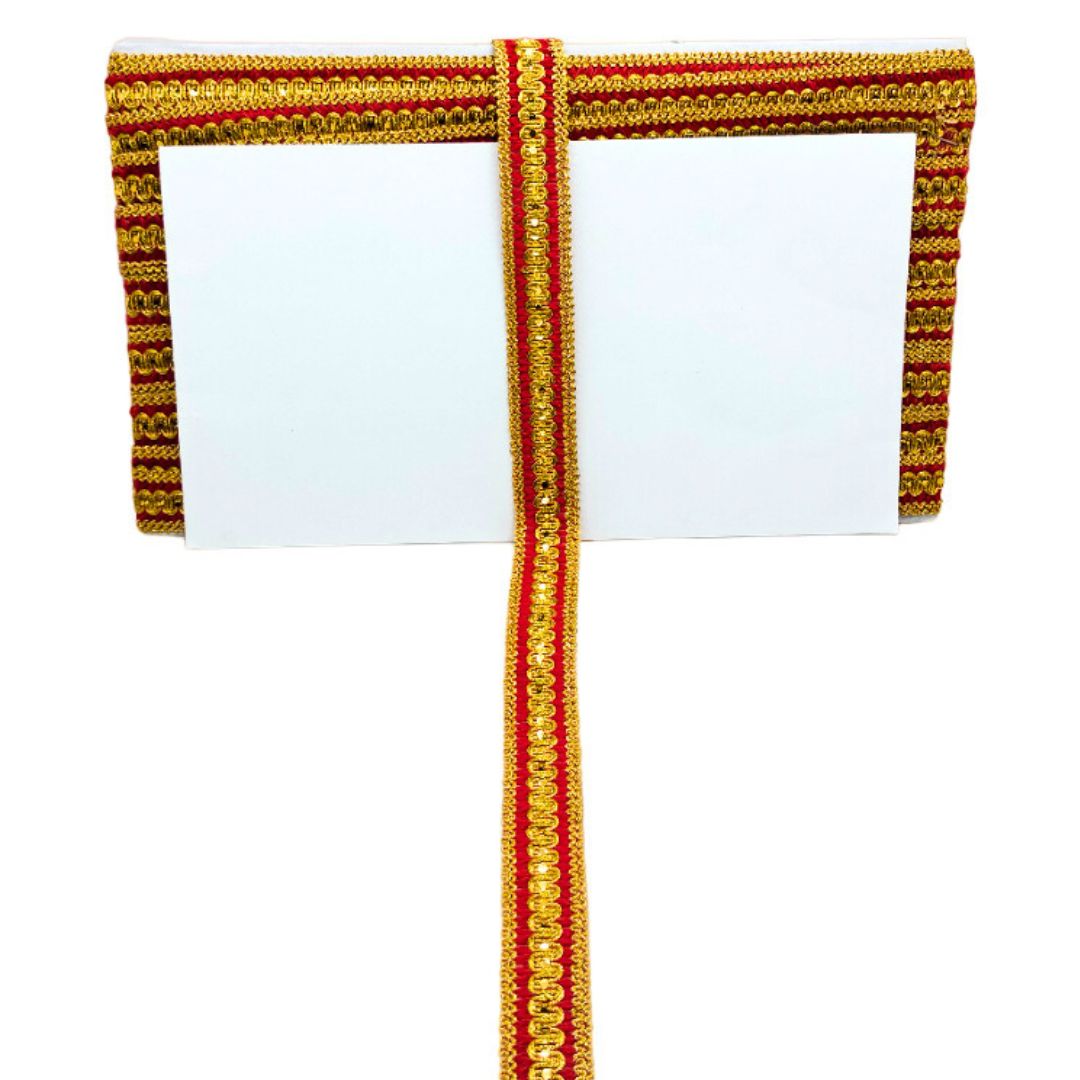 Decorative ribbon with gold and red pattern on a white background