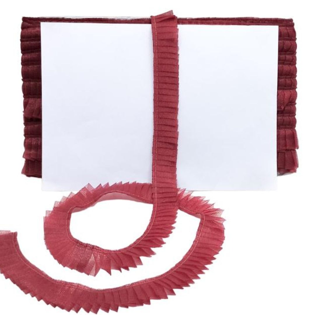 Red ruffled trim on a white background