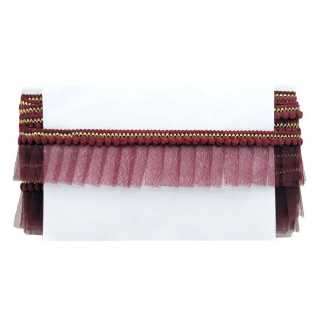Maroon tassel trim on a white background