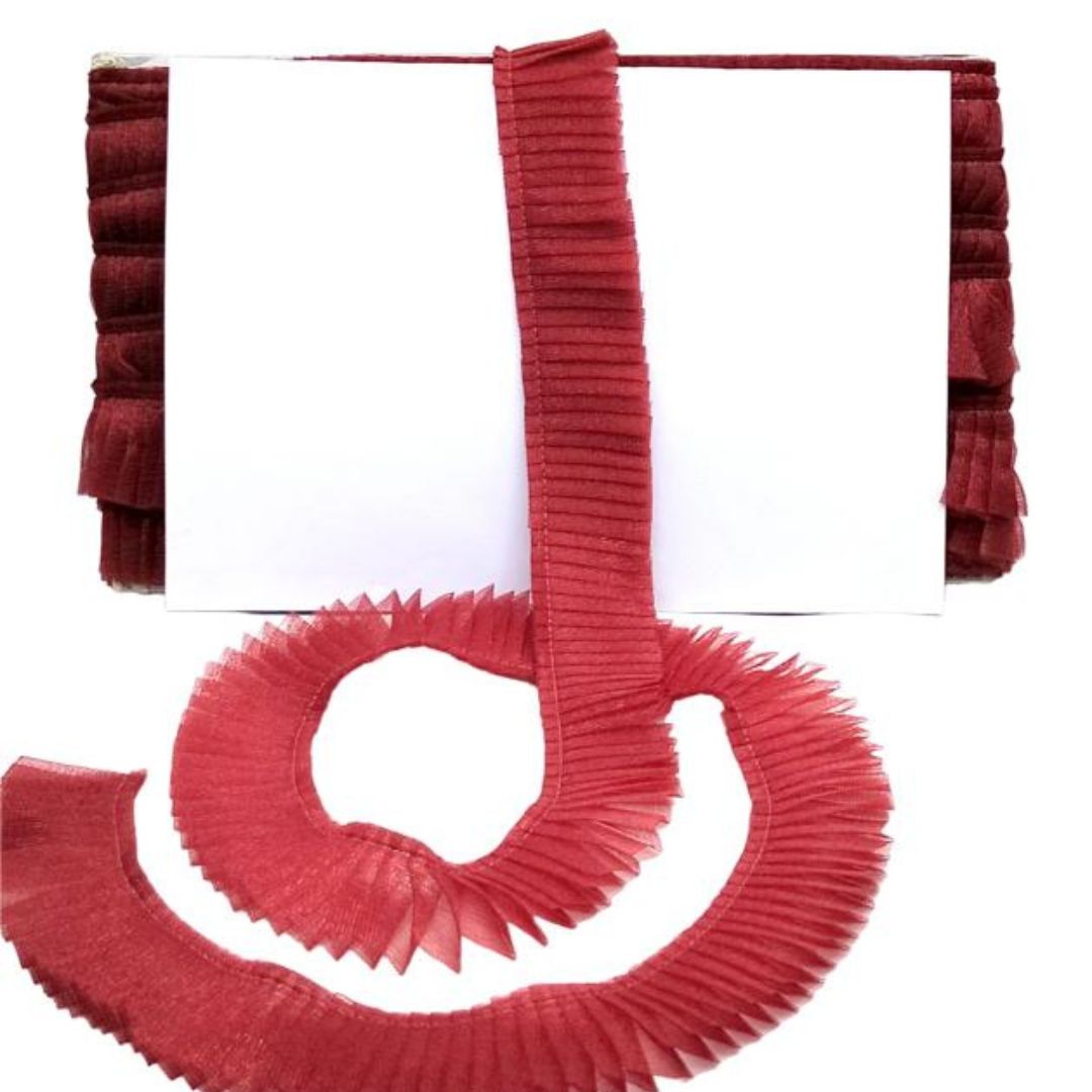 Red pleated ribbon on a white background