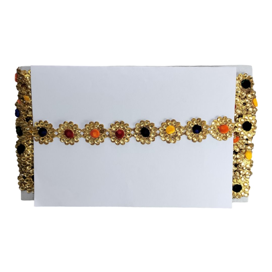 Decorative headband with gold frame and colorful stones on a white background