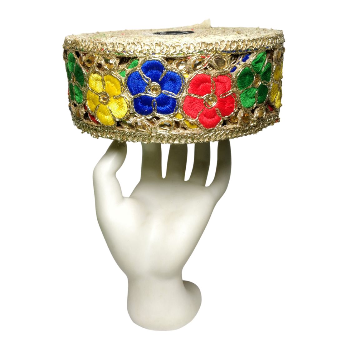 Decorative headband with colorful flowers on a white mannequin head