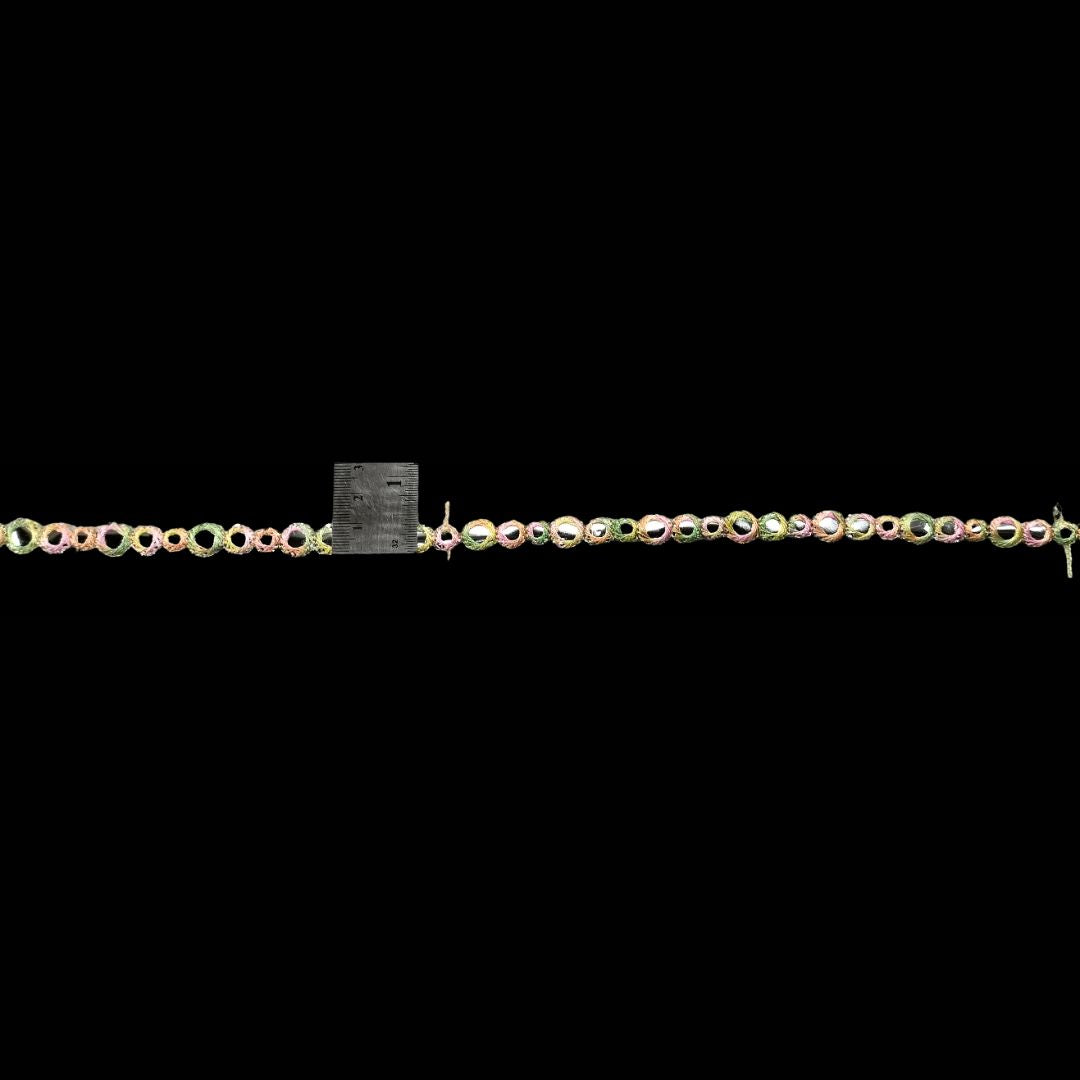 Necklace with multicolored beads on a black background
