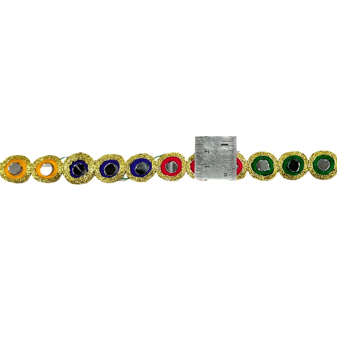 Multicolored gemstone bracelet with a ruler for size reference on a white background