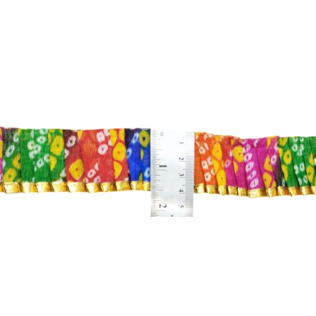 Colorful fabric border with a ruler for measurement on a white background
