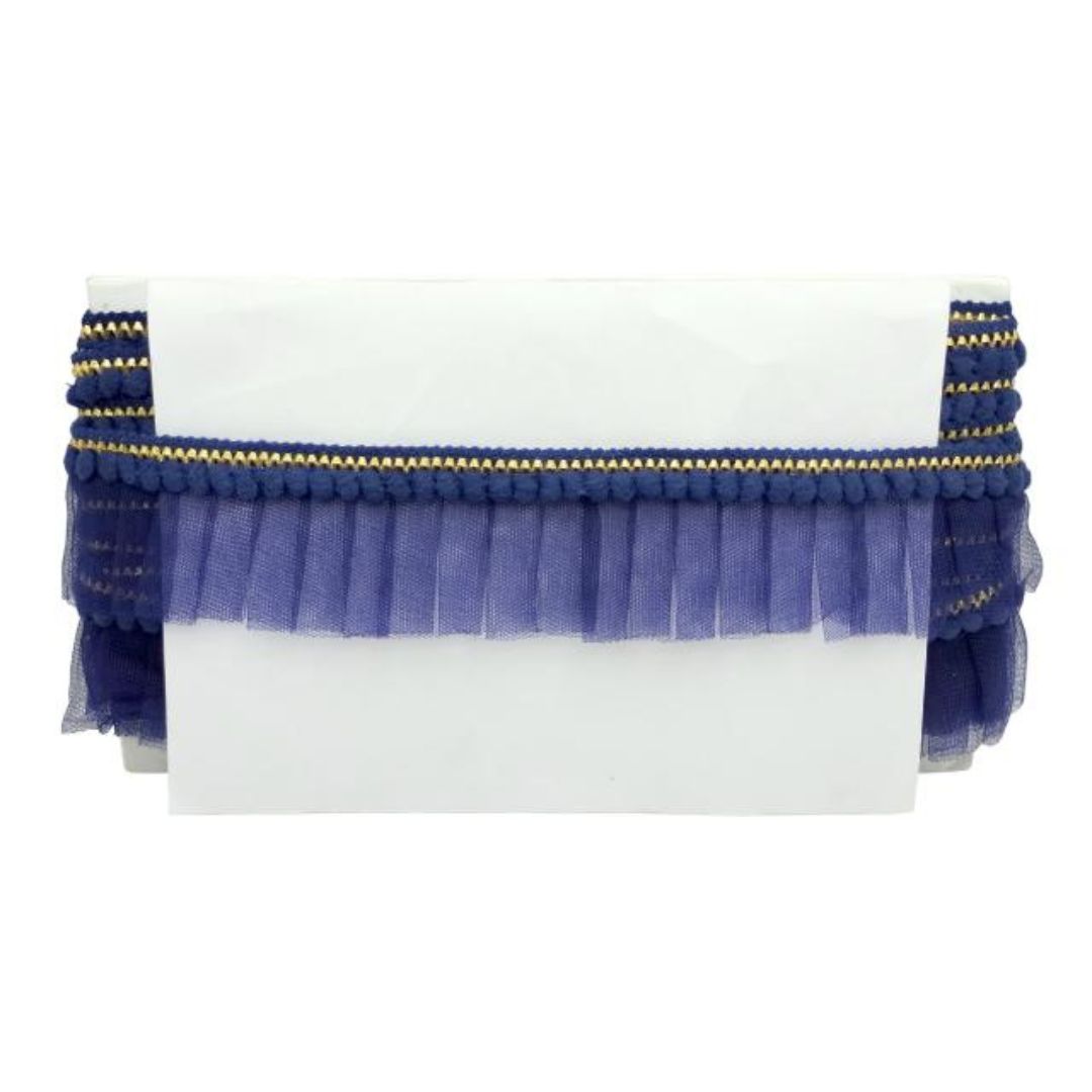 White clutch with blue and gold decorative trim on a white background