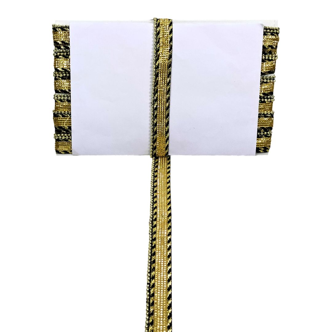 Decorative gold and black ribbon on a white background